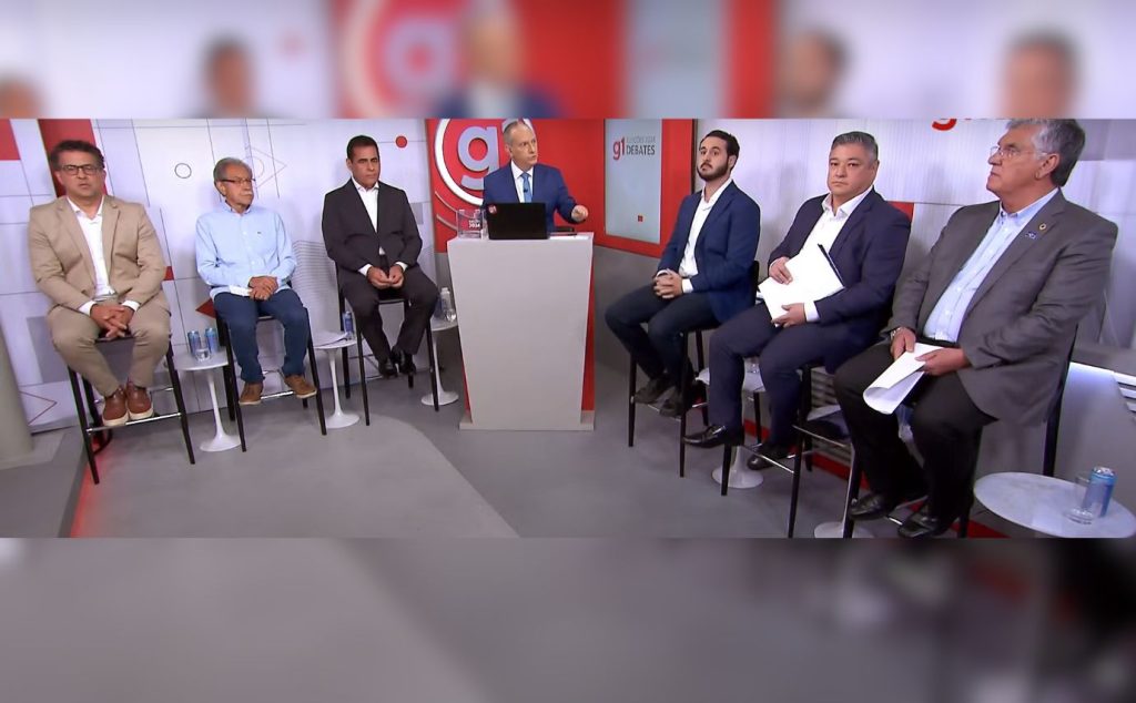 Candidatos de Guarulhos levam bronca de jornalista da Globo em debate: ‘Acalmem-se’