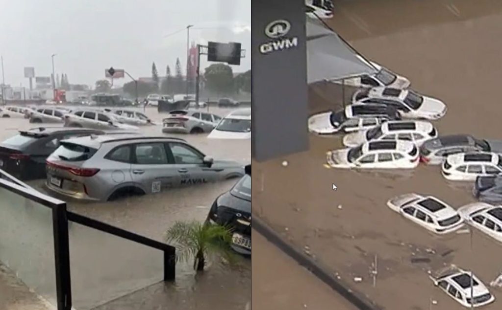 Alagamento em Guarulhos trava trânsito na Dutra e deixa carros debaixo d’água em concessionária