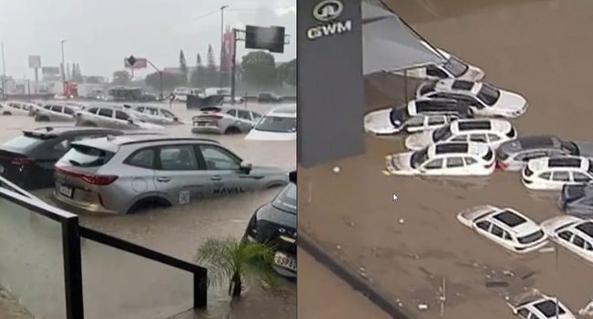 Via Dutra com carros alagados na concessionária GWM, em Guarulhos